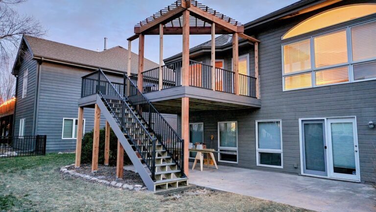 Elevated deck with pergola roof and custom stairs