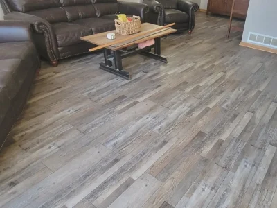Living room remodel with new gray vinyl plank flooring